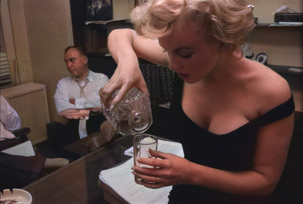 Marilyn Monroe Pouring a Drink for her Husband Arthur Miller, 1958